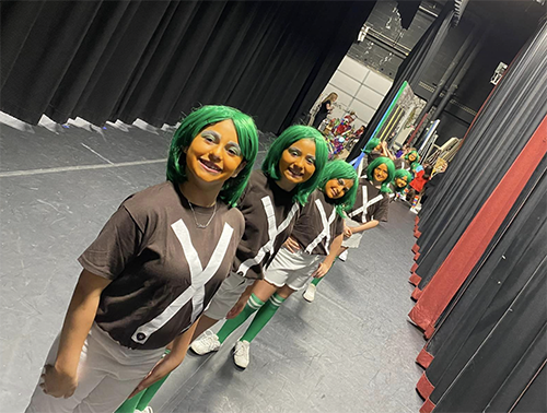 Parkway Elementary School's third and fourth graders on stage in costume with green hair