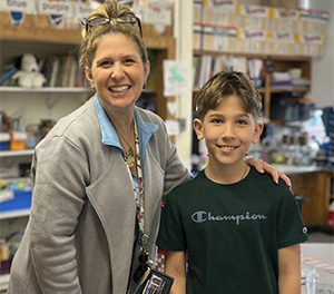 one male student and an aide