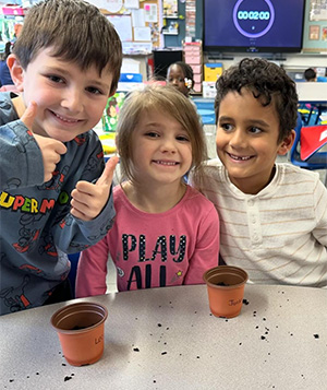 Three students with two pots